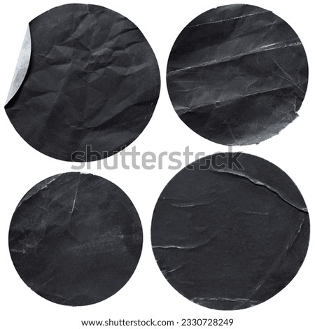Round black paper stickers on white background with clipping path