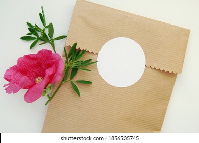 Round Blank Sticker Mockup, Circle Tag Mock Up On Kraft Paper Gift Bag, Adhesive Thank You Card, Round Product Label, Pink Flowers. 