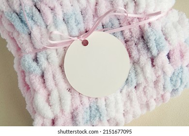 Round Blank Tag Hanging On Handmade Knitted Sweater, Price Label Mockup, Circle Hangtag For Design, Logo Presentation Or Text.