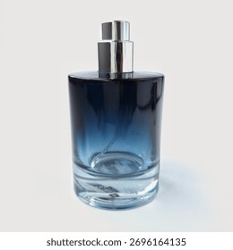Round blue bottle with a gradient effect, transitioning from deep blue at the top to clear at the base. It features a sleek, silver metallic spray nozzle atop. The bottle has a glossy finish