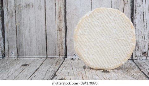 Round Blue Cheese Over Wooden Background