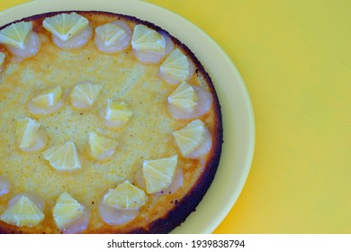 A Round Boiled Meyer Lemon, Almond And Olive Oil Cake With Sliced Lemons On Top