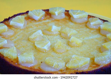 A Round Boiled Meyer Lemon, Almond And Olive Oil Cake With Sliced Lemons On Top