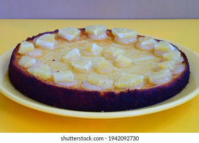 A Round Boiled Meyer Lemon, Almond And Olive Oil Cake With Sliced Lemons On Top