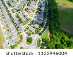 Round a bout in Pflugerville , Texas real estate development suburb with huge circle architecture design. Houses and homes living right outside Austin , TX