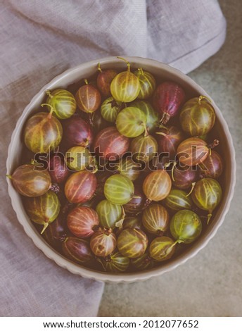 Similar – Image, Stock Photo Top view of organic gooseberries in a vintage bowl