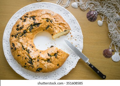 Round Cake With Chocolate Chunks, Knife On A Plate From Above