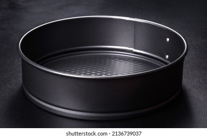 Round Cake Pan, Tray Or Mould On A Black Concrete Background. Cooking At Home