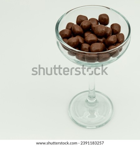 Round chocolates in a glass bowl