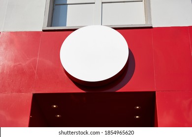 Round Circle As A Shield Mock-up Template For Logo Design On A Building In The City