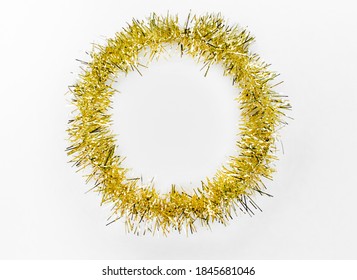 Round Circle Of Yellow, Golden Tinsel On A White Background. Christmas Decorations. New Year Concept