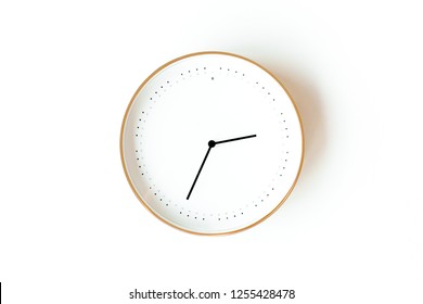 Round clock isolated on white background. Minimal concept. Flat lay. Top view.