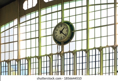 A Round Clock Stuck On The Wall.