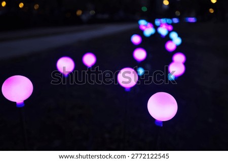 Round colored bulbs lined up side by side.