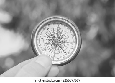 round compass on natural background as symbol of tourism with compass and travel with compass and outdoor activities with compass - Shutterstock ID 2256897669