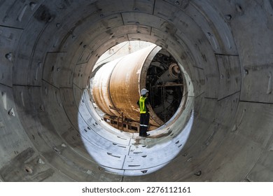 Round concrete elements segment built subway tunnel under construction  Tunnel boring machine construction site building metro and engineer to control 