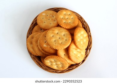 round cracker biscuits or cookie isolated in basket,top view in white background