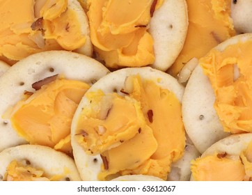 Round Crackers With Sharp Cheddar Cheese Almond Spread.