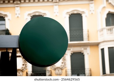 round cricular logo brand mockup backlight on sidewalk with an historic building in unfocused in background