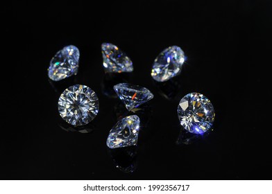 Round Diamond Faceted Cubic Zirconia Set Lot, Cubic Crystalline Form Of Zirconium Dioxide (ZrO2) Colorless Synthesized Material. White Synthetic Gemstones. Diamond Imitation. Black Isolated Background