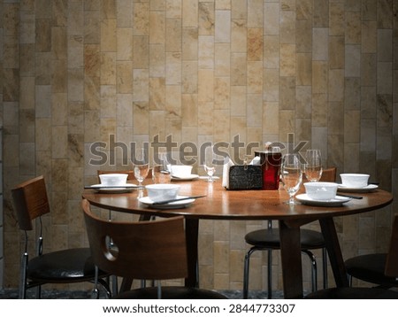 Round dining table setup inside a restaurant
