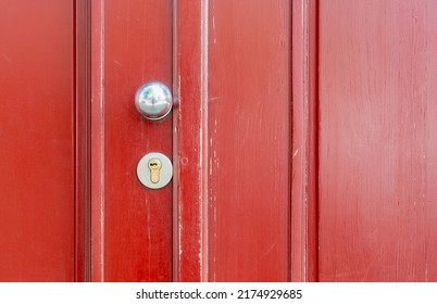 Round Door Handle For Dark Red Wood Doors.  Copy Space