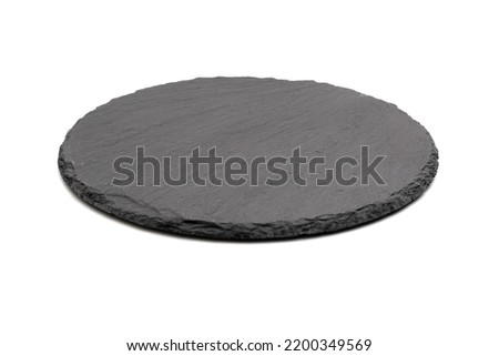 round empty black stone plate