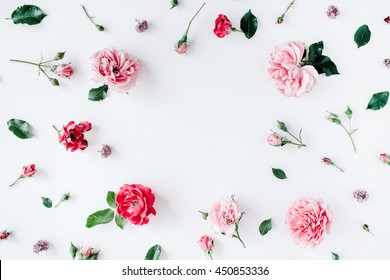 round frame wreath pattern with roses, pink flower buds, branches and leaves isolated on white background. flat lay, top view - Shutterstock ID 450853336