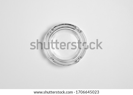 Round glass ashtray isolated on white background.High resolution photo.Top view.