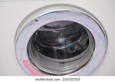 Round Glass Door Of Modern Washing Machine Close Up

