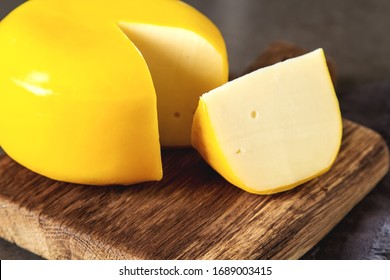 Round Gouda Cheese. Dark Background