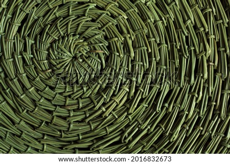 round green rug, woven by hand from pine needles