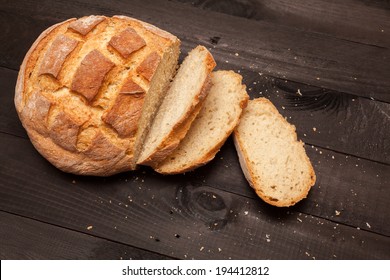 Round Loaf Bread With Some Slices Cut
