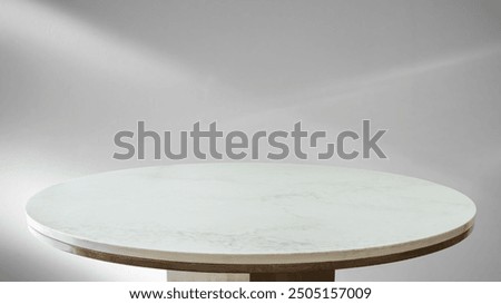 Round marble table top with abstract shadow drop on white wall background for mockup product display