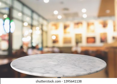 round marble table top with cafe restaurant bokeh lights abstract background for montage product display