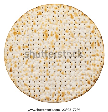 Round Matze cracker. Top view isolated on a white background.