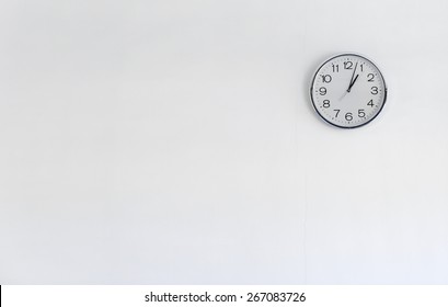 Round Metal Clock On White Wall