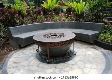 The Round Metallic Table And Cement Semi Circle Bench In The Park 