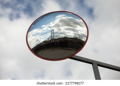 Round Mirror. Reflector In Parking Lot. Mirror For Safety. Reflective Surface.