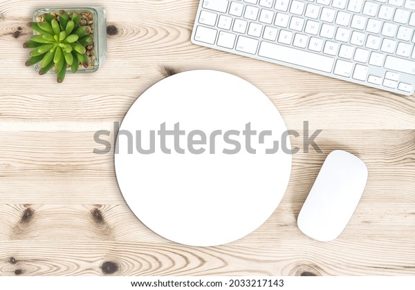 Round
mouse pad mock up. Office desk with
keyboard
