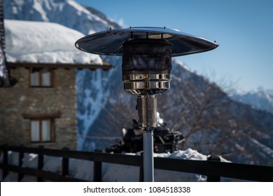 Round Mushroom Propane Patio Heater In The Snow In Italy