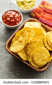 Round Nacho Chips. Yellow Tortilla Chips In Bowl On Old Kitchen Table.