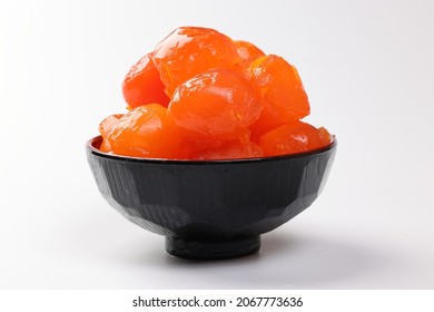 Round Orange Salted Egg Yolk Cuisine Cake Ingredient On In Small Dark Bowl White Background Closeup Macro