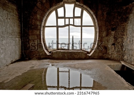 A round panoramic window in the room where the office of Prince Oldenburg was located. Palace of Prince Alexander of Oldenburg. Gagra. Republic of Abkhazia