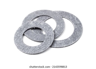 Round paronite gaskets for pipe flange connections isolated on white - Shutterstock ID 2143598813
