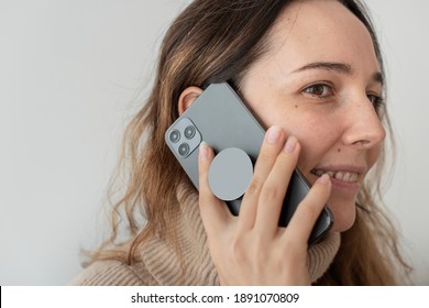 Round Phone Grip Behind The Mobile With Woman Talking On The Phone