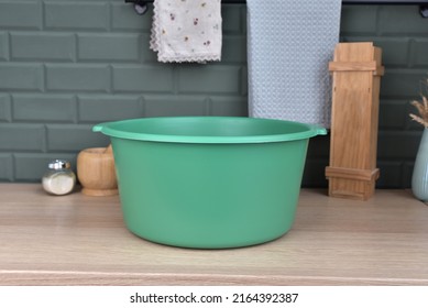 Round Plastic Basin. Green Basin On The Table