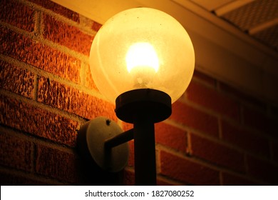 Round Porch Light Lit At Night