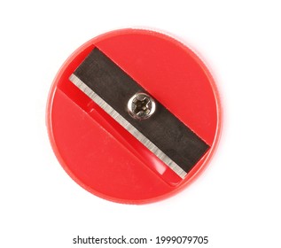Round red plastic pencil sharpener isolated on white background, top view