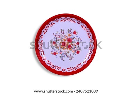 Round red stainless steel tray isolated on white background. Top view